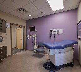 Medical room with patient table and medical equipment