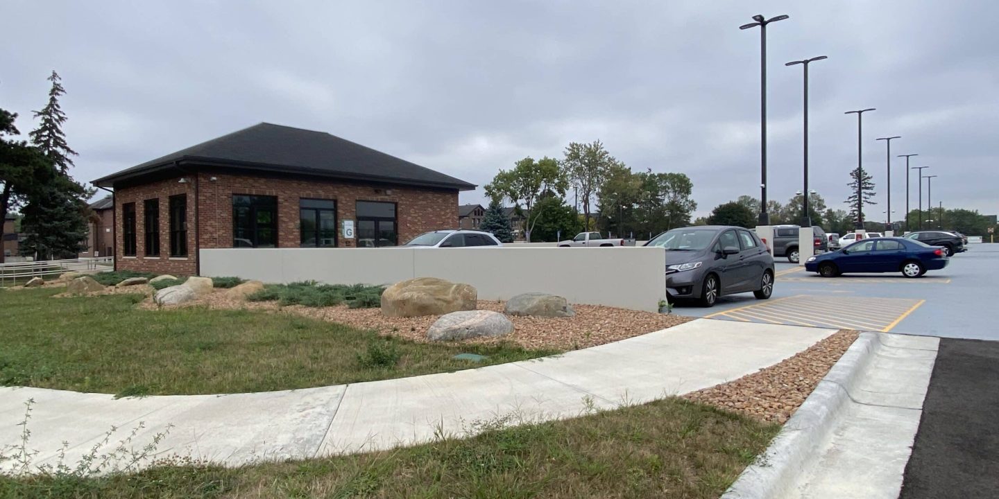 Sidewalk leading into parking lot