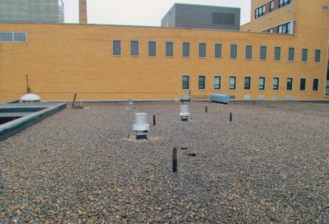 Roof with machinery and exhaust pipes