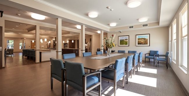 Table surrounded by chairs in community living center