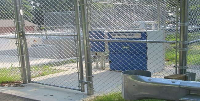 Emergency generator machinery behind fence