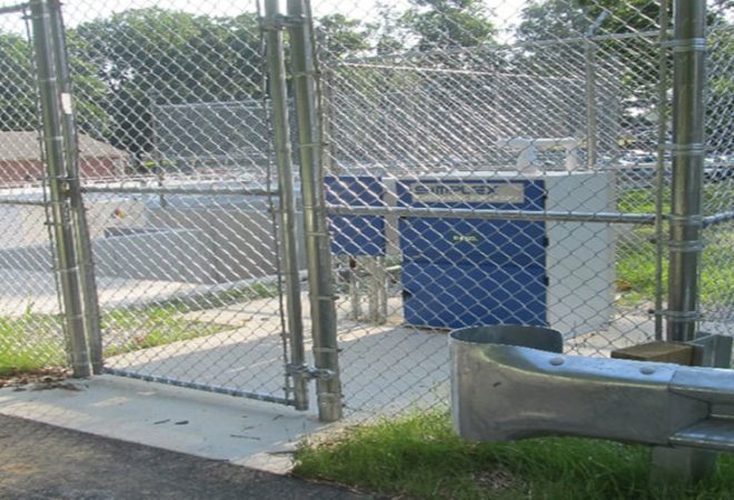 Emergency generator machinery behind fence