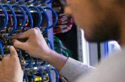 Man working in server cabinet